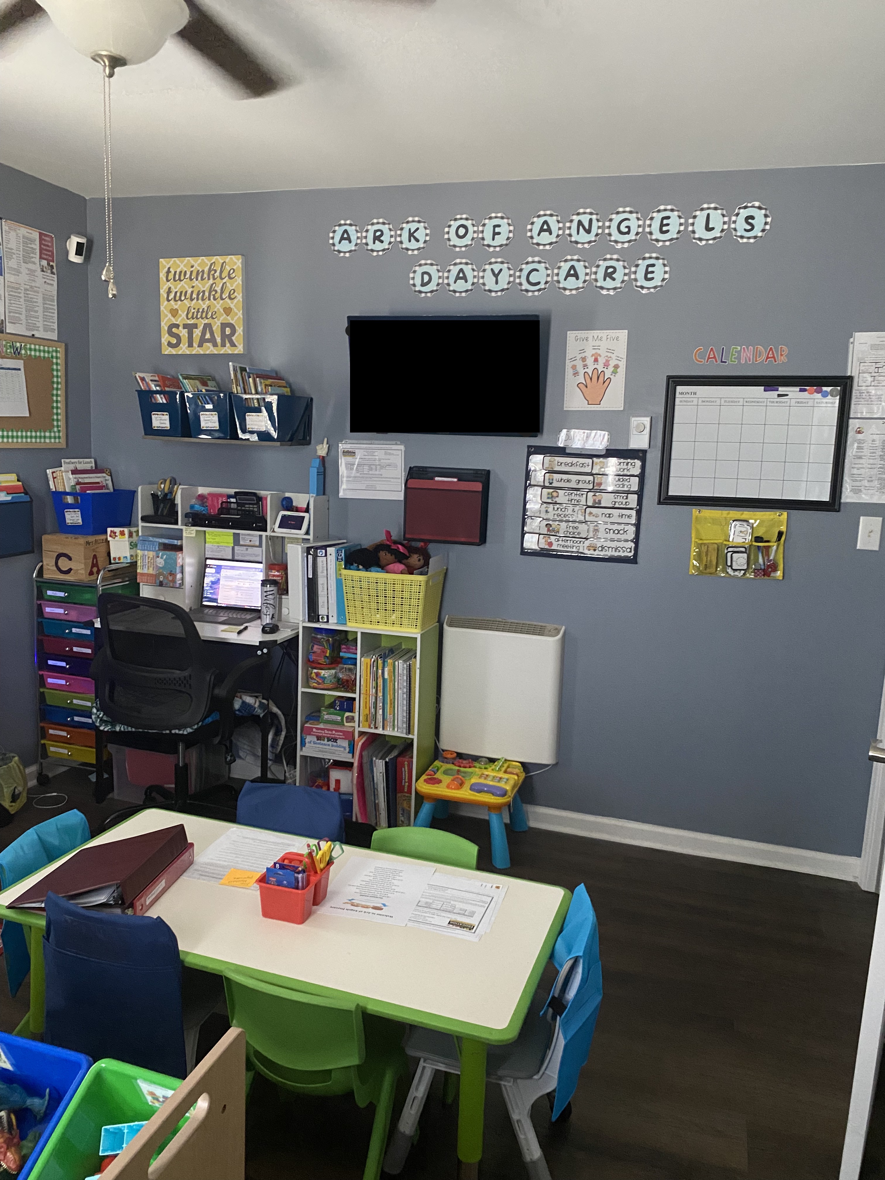 Main classroom with Ark of Angels signage and TV